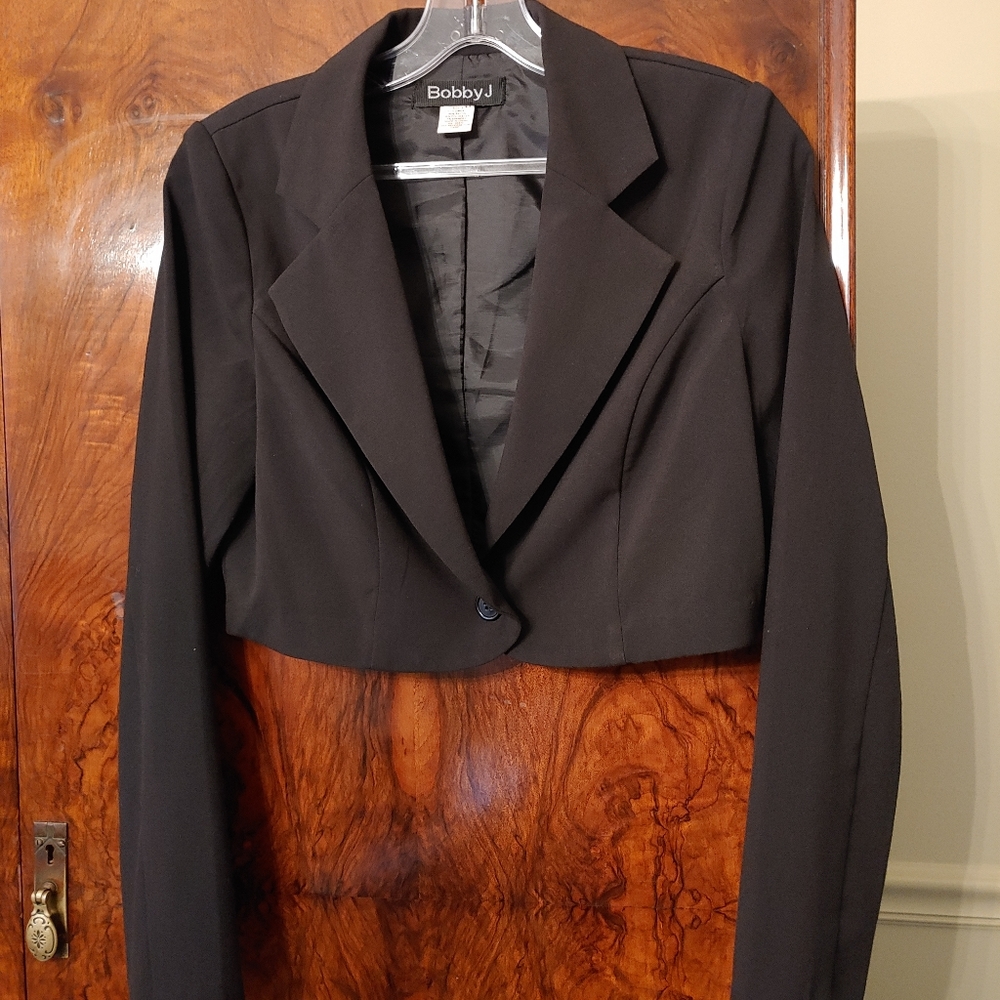 Black jacket can be worn as a shrug